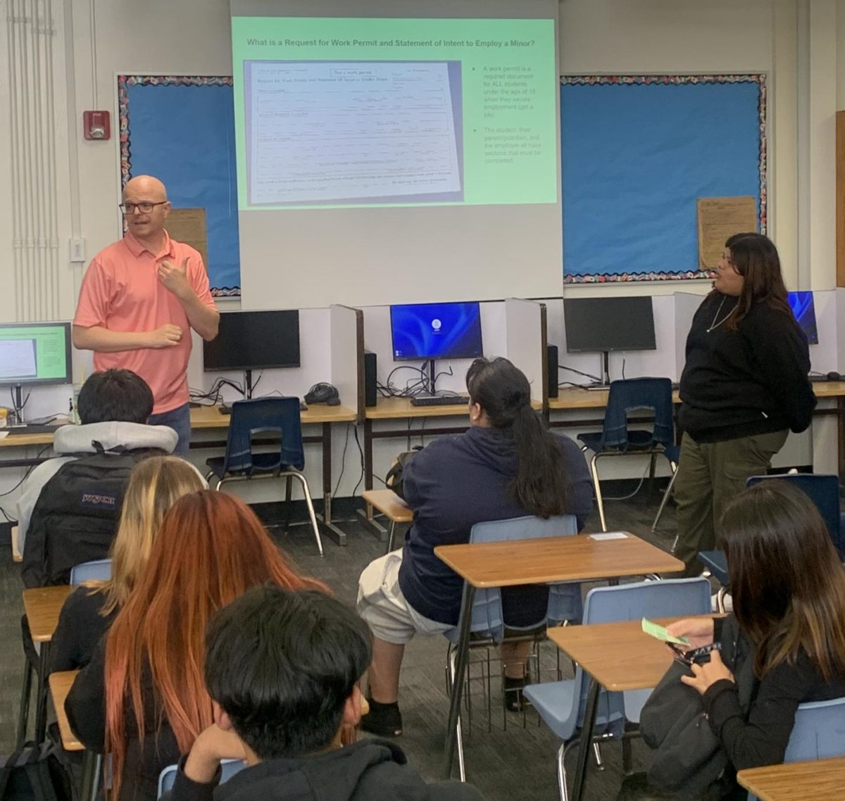 Mr. Dechene speaks to students during orientation about work permits and careers. 