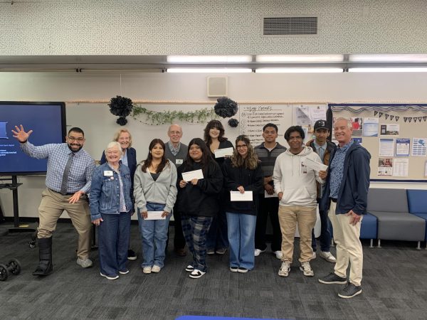 Mr. Lara, representatives from Kiwanis Club of Anaheim, Mr. Glenn, and seven of the ten scholarship recipients celebrate in the Parent Center today.
