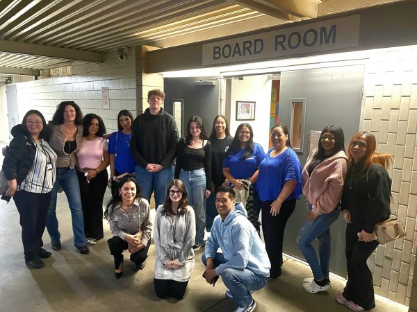 Gilbert Family outside Board Room:
Students, Staff,  Alumni, and Parents enjoy a photo op after students presented to the Board. 