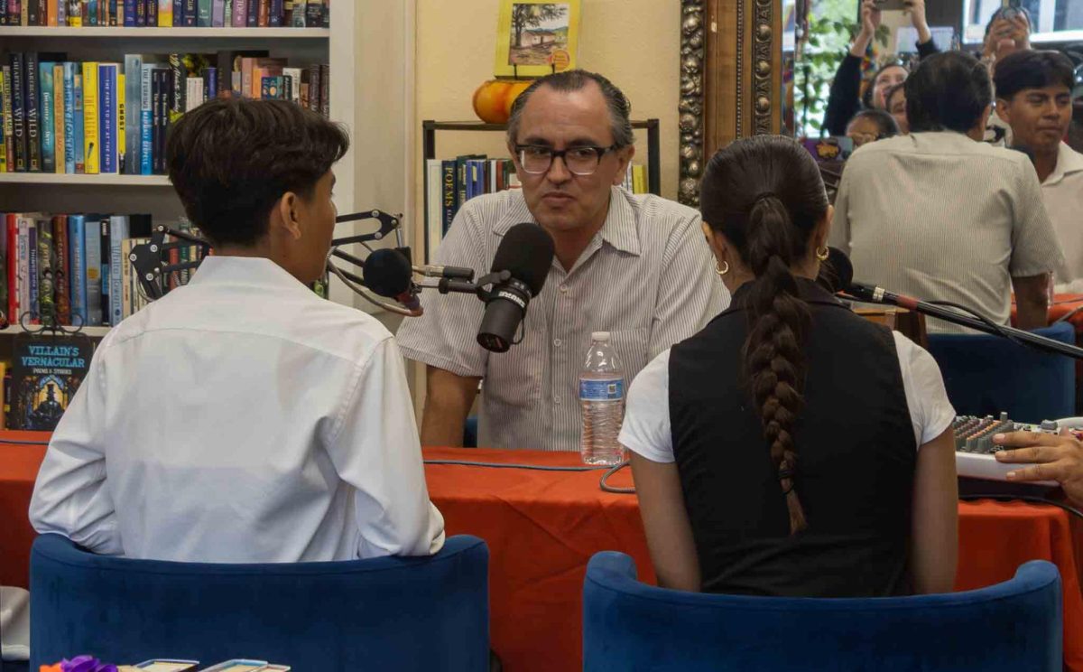 Gustavo Arellano answers questions from students at the Mexican heritage event at the Untold Story Bookstore. 