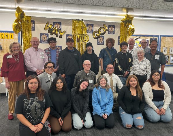 Kiwanis of Greater Anaheim members pose with School Board trustees, scholarship recipients, and their friends.